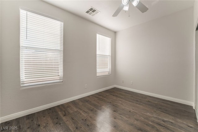 5940 Tamarack Lodge Ln, North Las Vegas, NV 89081 - spare room featuring ceiling fan, baseboards, dark wood-type flooring, and visible vents