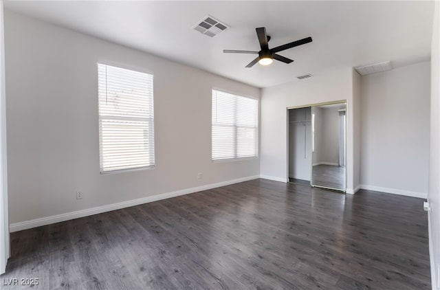 5940 Tamarack Lodge Ln, North Las Vegas, NV 89081 - unfurnished bedroom with dark wood-style floors, visible vents, a closet, baseboards, and ceiling fan