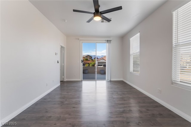 5940 Tamarack Lodge Ln, North Las Vegas, NV 89081 - empty room with baseboards, a ceiling fan, and dark wood-type flooring