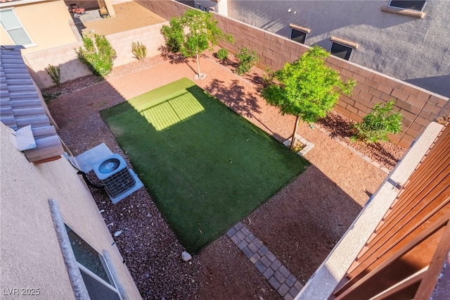 5940 Tamarack Lodge Ln, North Las Vegas, NV 89081 - view of yard with a fenced backyard and central air condition unit