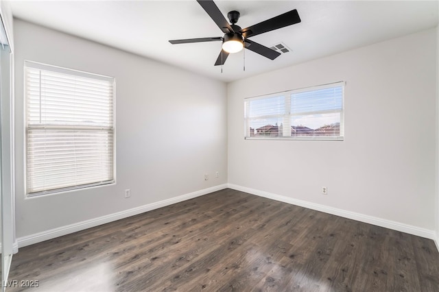 5940 Tamarack Lodge Ln, North Las Vegas, NV 89081 - empty room with dark wood finished floors, baseboards, a ceiling fan, and visible vents