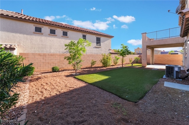 5940 Tamarack Lodge Ln, North Las Vegas, NV 89081 - view of yard with a patio area, a fenced backyard, a balcony, and cooling unit