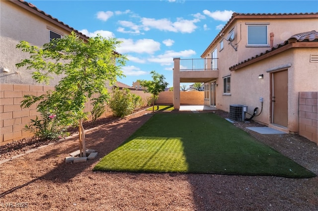 5940 Tamarack Lodge Ln, North Las Vegas, NV 89081 - view of yard with central air condition unit, a fenced backyard, and a balcony