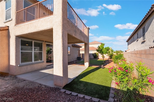 5940 Tamarack Lodge Ln, North Las Vegas, NV 89081 - view of yard featuring cooling unit, a patio, a fenced backyard, and a balcony