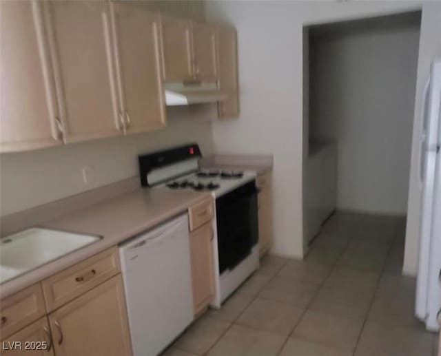 7709 Bauble Ave, Las Vegas, NV 89128 - kitchen with light tile patterned floors, a sink, light countertops, white appliances, and extractor fan