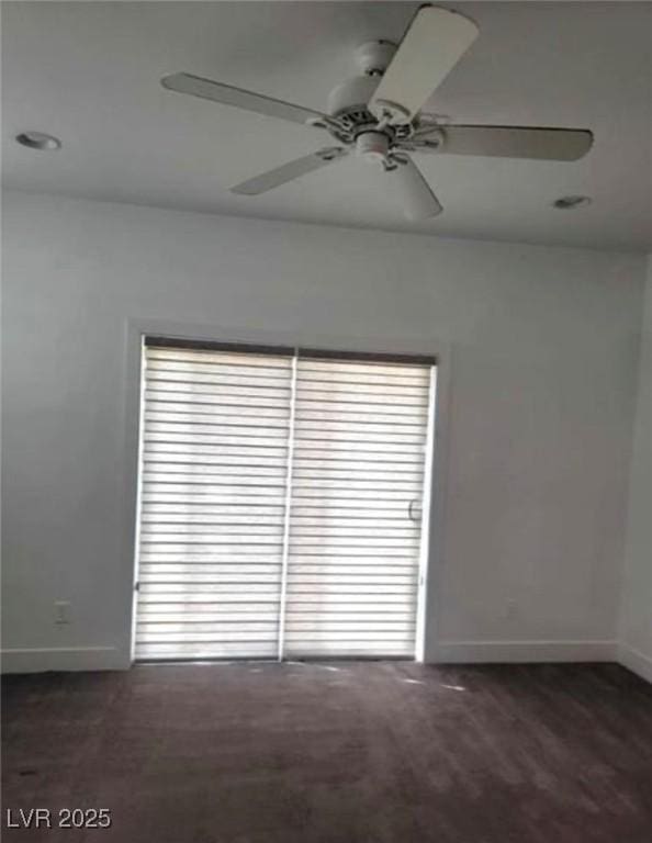 unfurnished room with baseboards and a ceiling fan