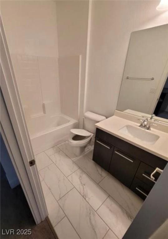 bathroom featuring toilet, marble finish floor, vanity, and  shower combination