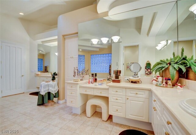 full bathroom featuring tile patterned flooring and vanity