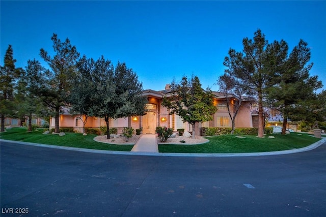 obstructed view of property with a front yard