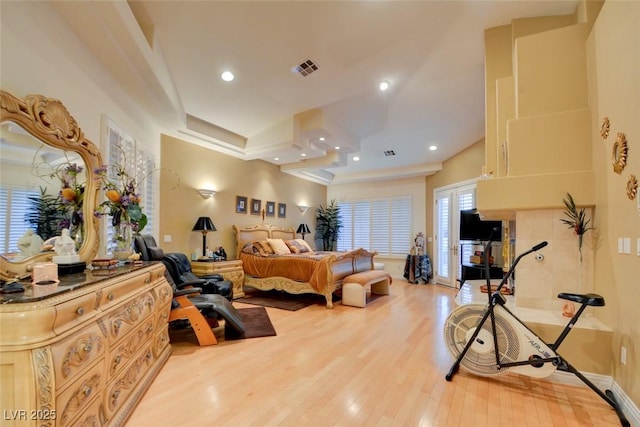 bedroom featuring recessed lighting, baseboards, visible vents, and wood finished floors