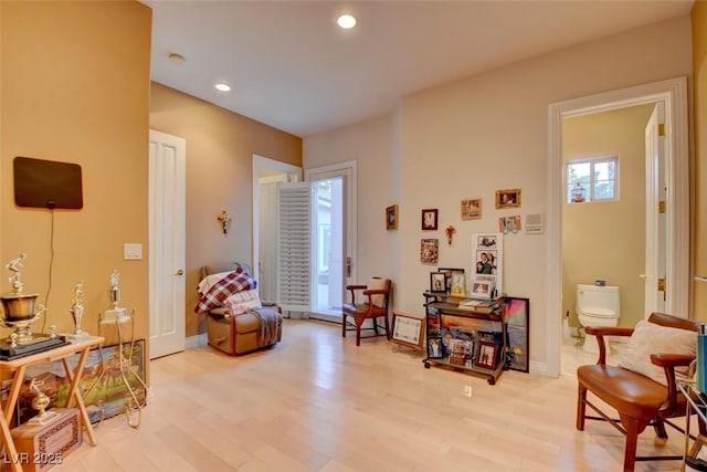 sitting room featuring light wood-style floors, recessed lighting, and baseboards