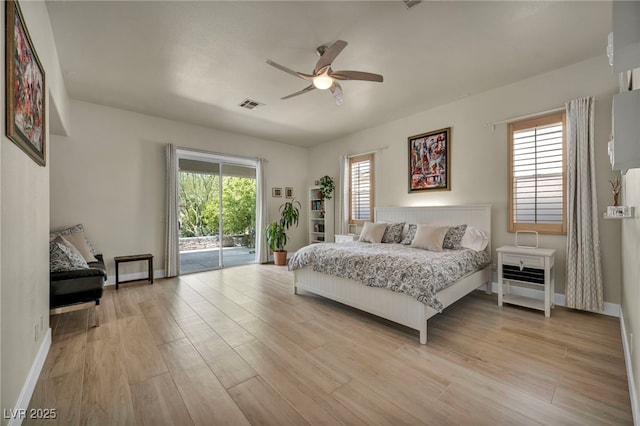 bedroom featuring access to outside, baseboards, visible vents, and light wood-type flooring