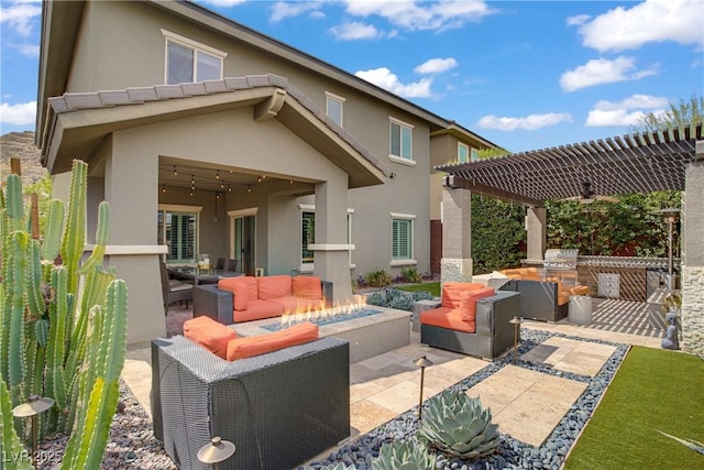 back of house with area for grilling, a patio, an outdoor hangout area, and stucco siding
