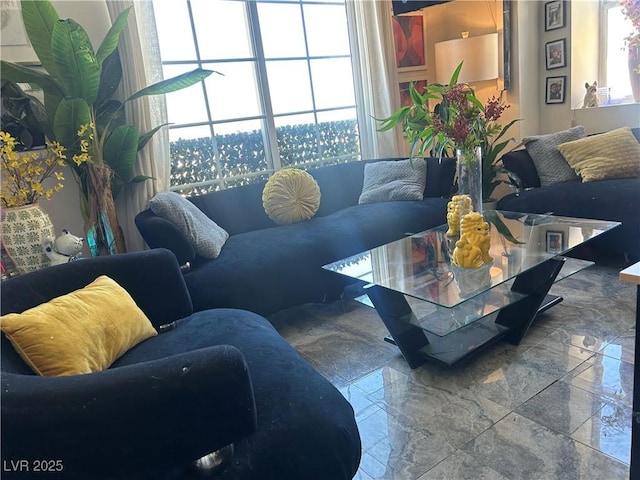 living area with marble finish floor