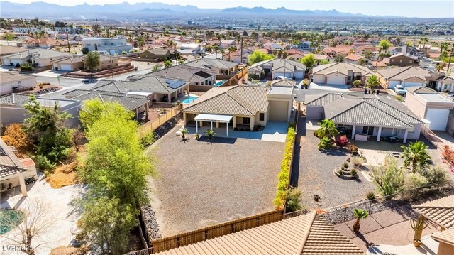drone / aerial view featuring a residential view and a mountain view
