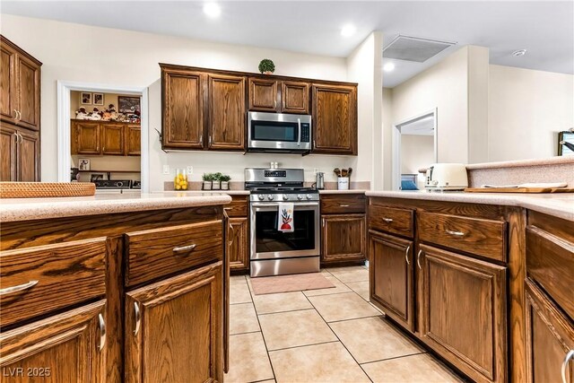 kitchen with recessed lighting, light countertops, visible vents, light tile patterned floors, and appliances with stainless steel finishes