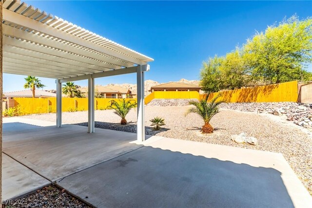 view of patio / terrace featuring a pergola and a fenced backyard