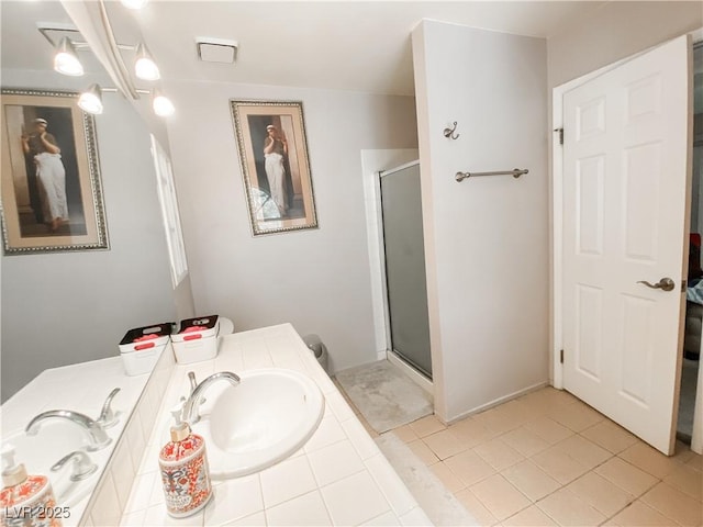 bathroom featuring a shower stall, tile patterned flooring, vanity, and visible vents