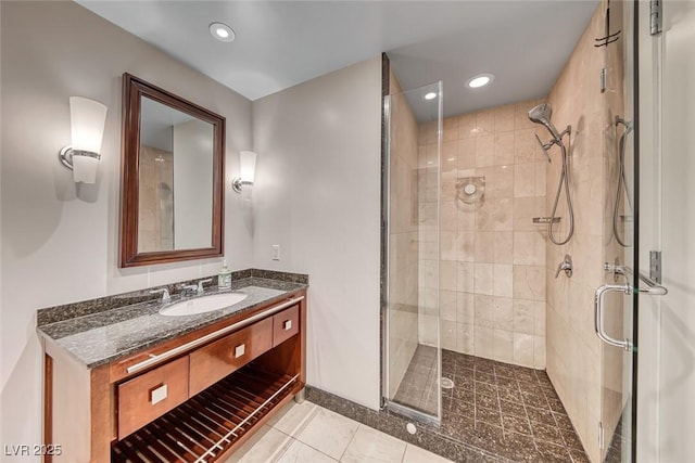 bathroom with vanity, recessed lighting, tile patterned floors, and a stall shower