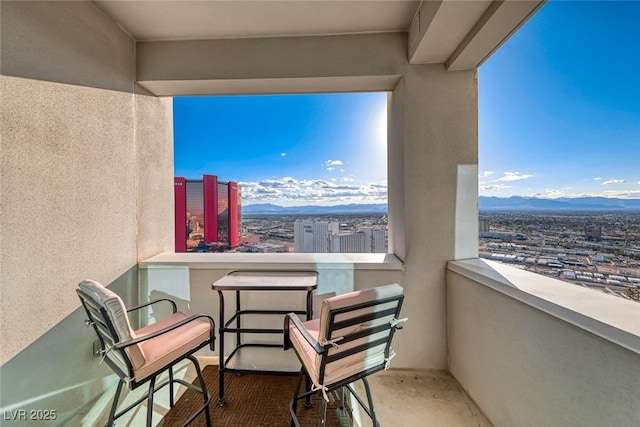 balcony featuring a mountain view