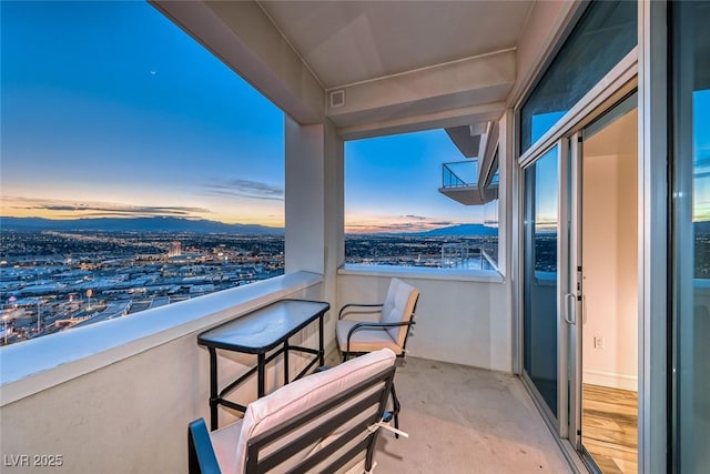 view of balcony at dusk