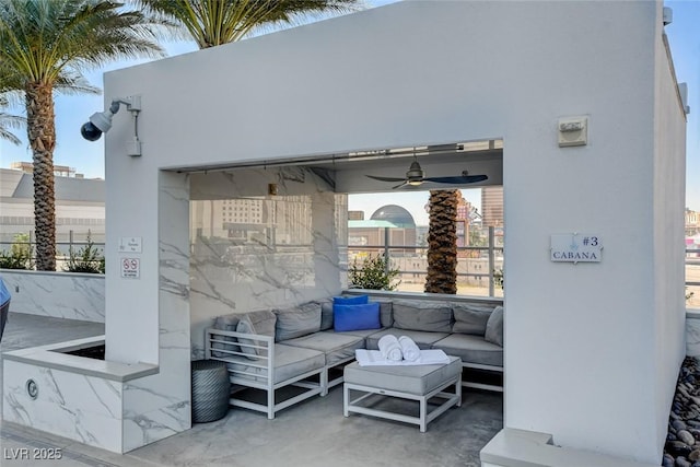 view of patio featuring a ceiling fan and an outdoor hangout area