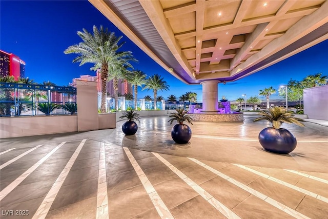 exercise room featuring recessed lighting, coffered ceiling, and decorative columns
