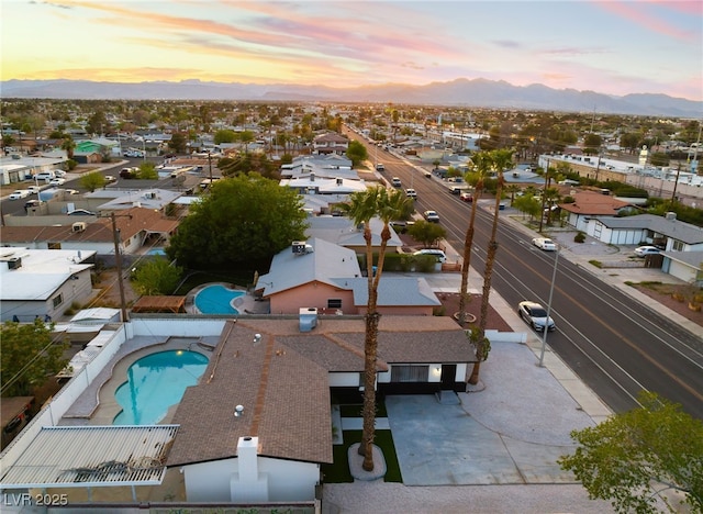 birds eye view of property with a mountain view and a residential view