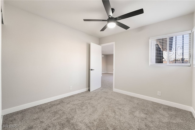 unfurnished bedroom featuring carpet floors, baseboards, and ceiling fan