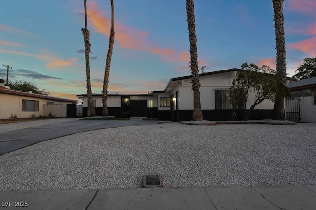 mid-century inspired home featuring driveway