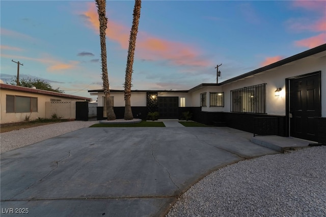 view of front of house featuring stucco siding