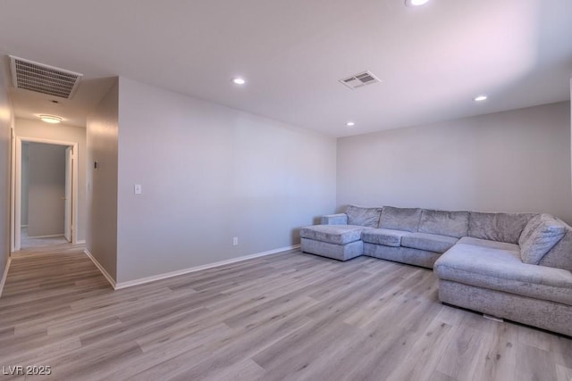 unfurnished living room with recessed lighting, light wood-style floors, and visible vents