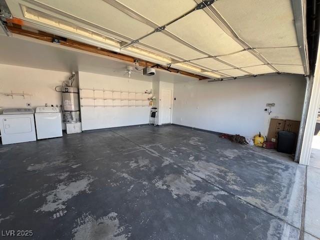 garage with secured water heater, washing machine and dryer, and a garage door opener