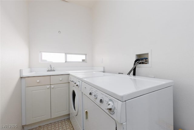 clothes washing area featuring light floors, a sink, cabinet space, and washer and clothes dryer