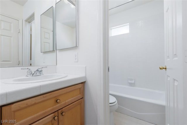 bathroom featuring toilet, vanity, and shower / bath combination