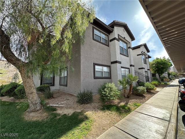 view of home's exterior with stucco siding