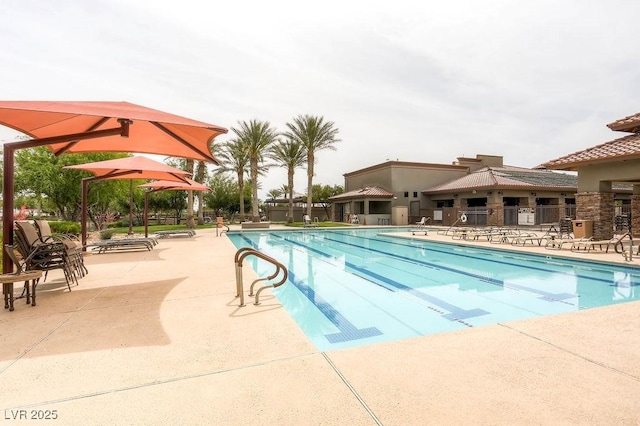 community pool with a patio area
