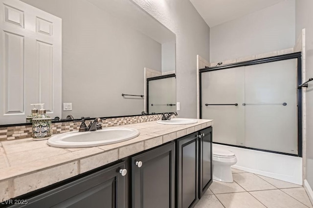 3908 Specula Wing Dr, North Las Vegas, NV 89084 - full bath with double vanity, combined bath / shower with glass door, and tile patterned flooring