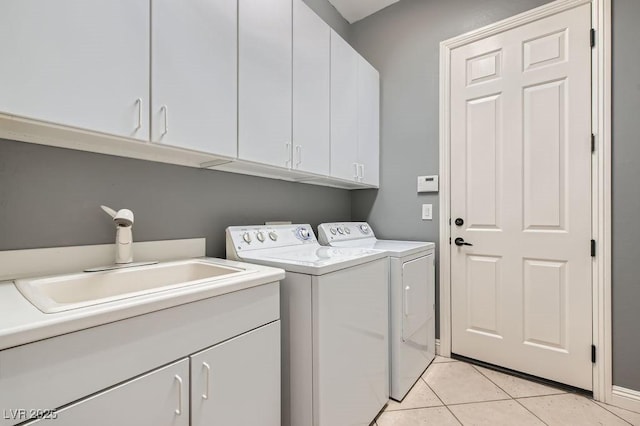 3908 Specula Wing Dr, North Las Vegas, NV 89084 - laundry room with cabinet space, washing machine and clothes dryer, and light tile patterned floors