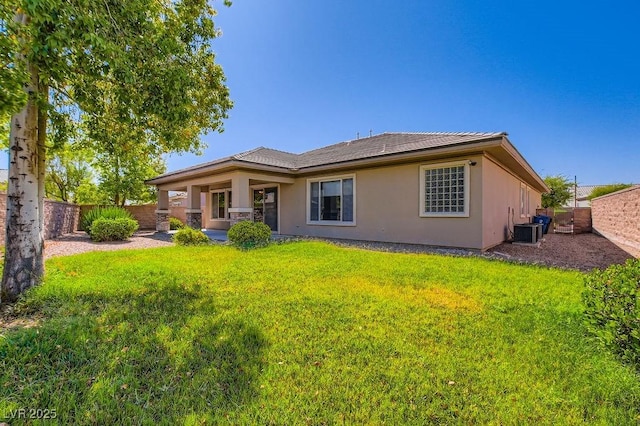 3908 Specula Wing Dr, North Las Vegas, NV 89084 - back of house featuring stucco siding and a fenced backyard