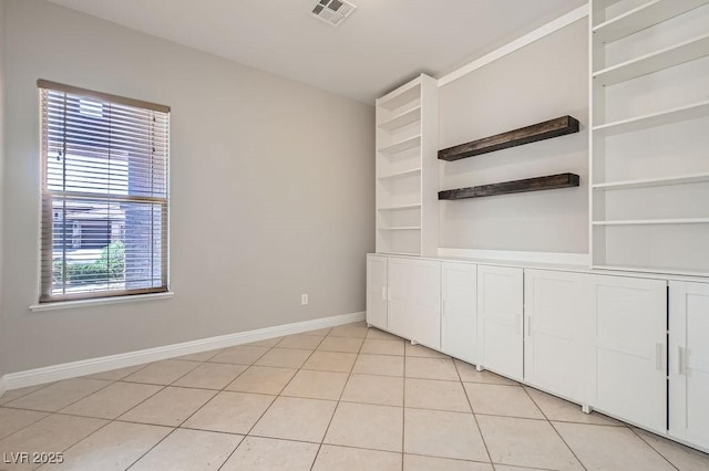 3908 Specula Wing Dr, North Las Vegas, NV 89084 - spare room with baseboards and light tile patterned floors