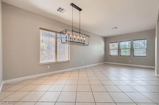 3908 Specula Wing Dr, North Las Vegas, NV 89084 - spare room featuring a chandelier and light tile patterned flooring