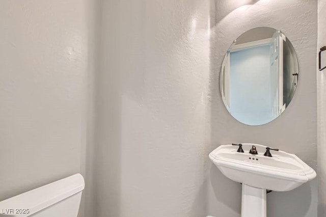 3908 Specula Wing Dr, North Las Vegas, NV 89084 - bathroom with toilet and a textured wall