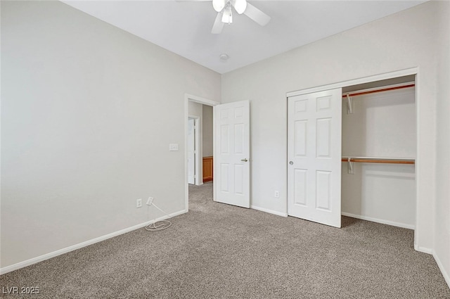 unfurnished bedroom with a closet, baseboards, a ceiling fan, and carpet floors