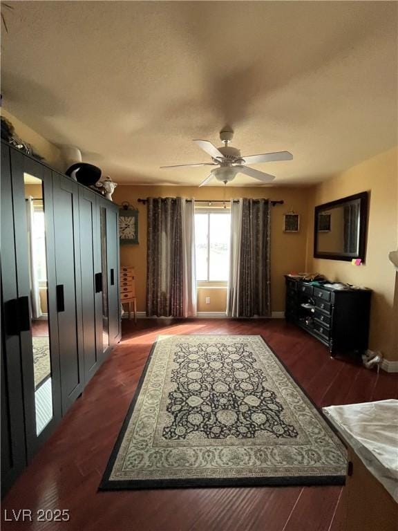 8690 W Ford Ave, Las Vegas, NV 89148 - living room featuring a ceiling fan, wood finished floors, and baseboards
