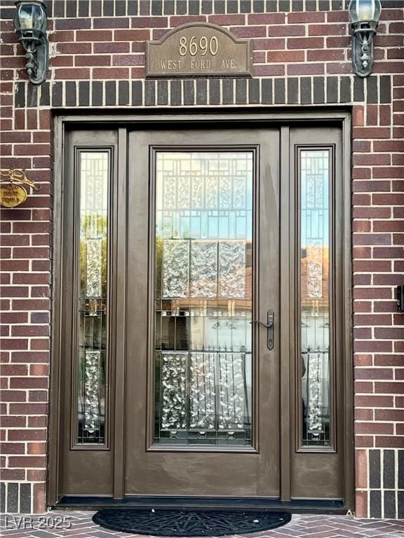 8690 W Ford Ave, Las Vegas, NV 89148 - doorway to property featuring brick siding