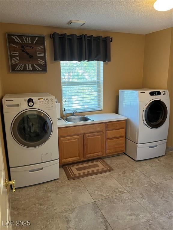 8690 W Ford Ave, Las Vegas, NV 89148 - laundry room with a textured ceiling and cabinet space