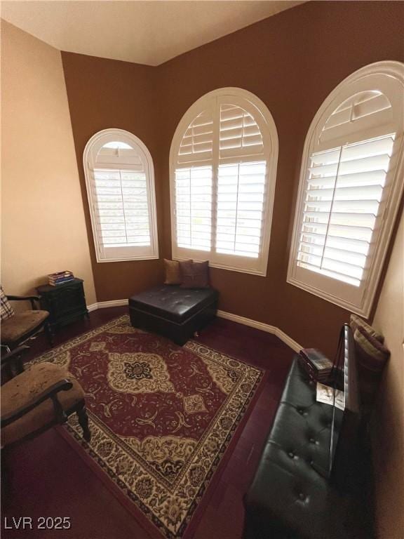 8690 W Ford Ave, Las Vegas, NV 89148 - living area with plenty of natural light, baseboards, and wood finished floors