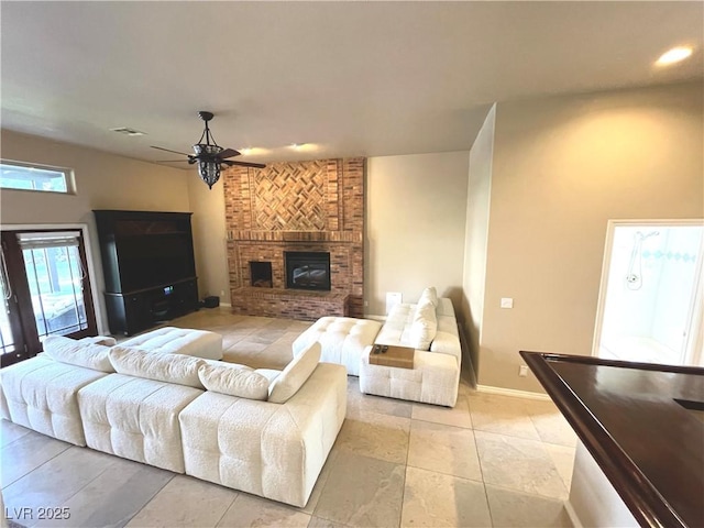 8690 W Ford Ave, Las Vegas, NV 89148 - living area with a ceiling fan, a fireplace, baseboards, and recessed lighting