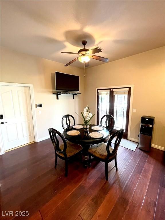 8690 W Ford Ave, Las Vegas, NV 89148 - dining space featuring dark wood finished floors, a ceiling fan, and baseboards